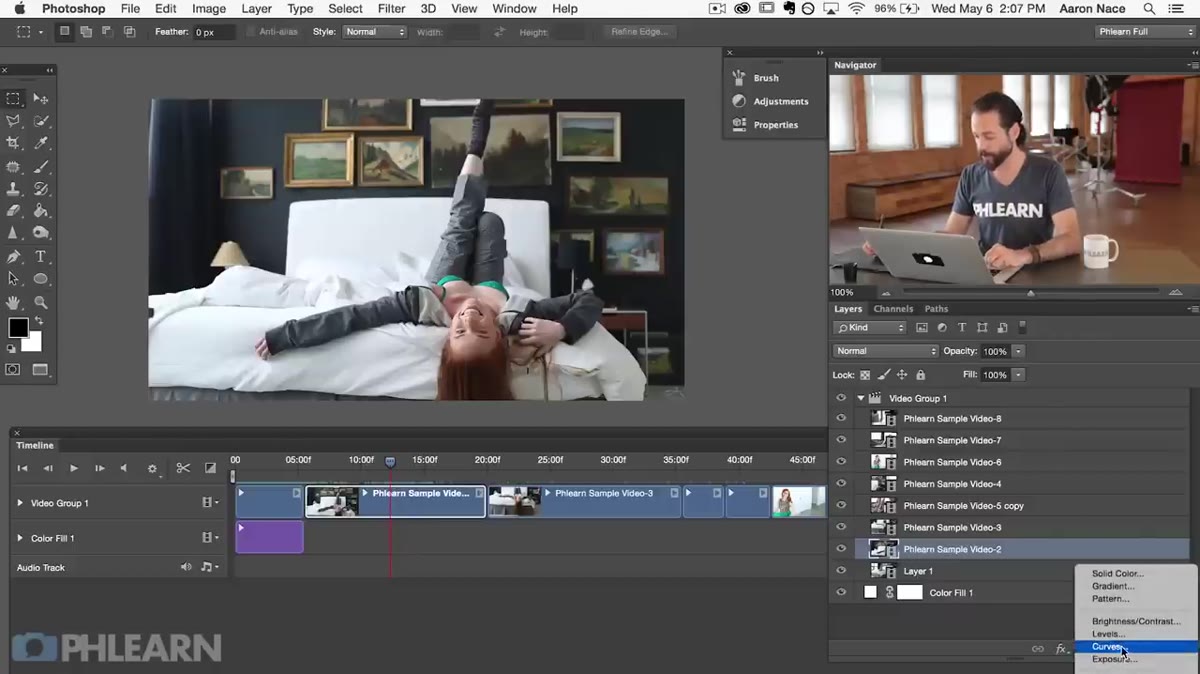 Curves adjustment layer dialog open in Photoshop over a video clip