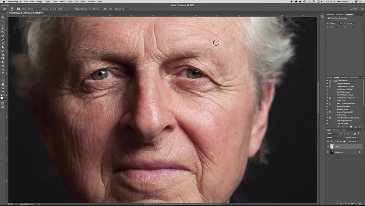 Clone Stamp tool active near a high-contrast edge on the portrait
