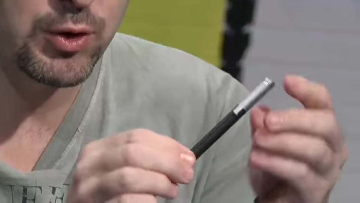 Corey holding the Bamboo Stylus next to his iPad