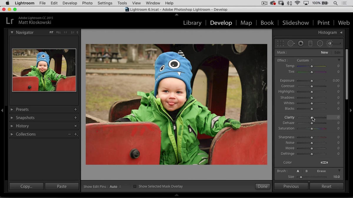 Adjustment brush being used over the subject&rsquo;s clothing in Lightroom
