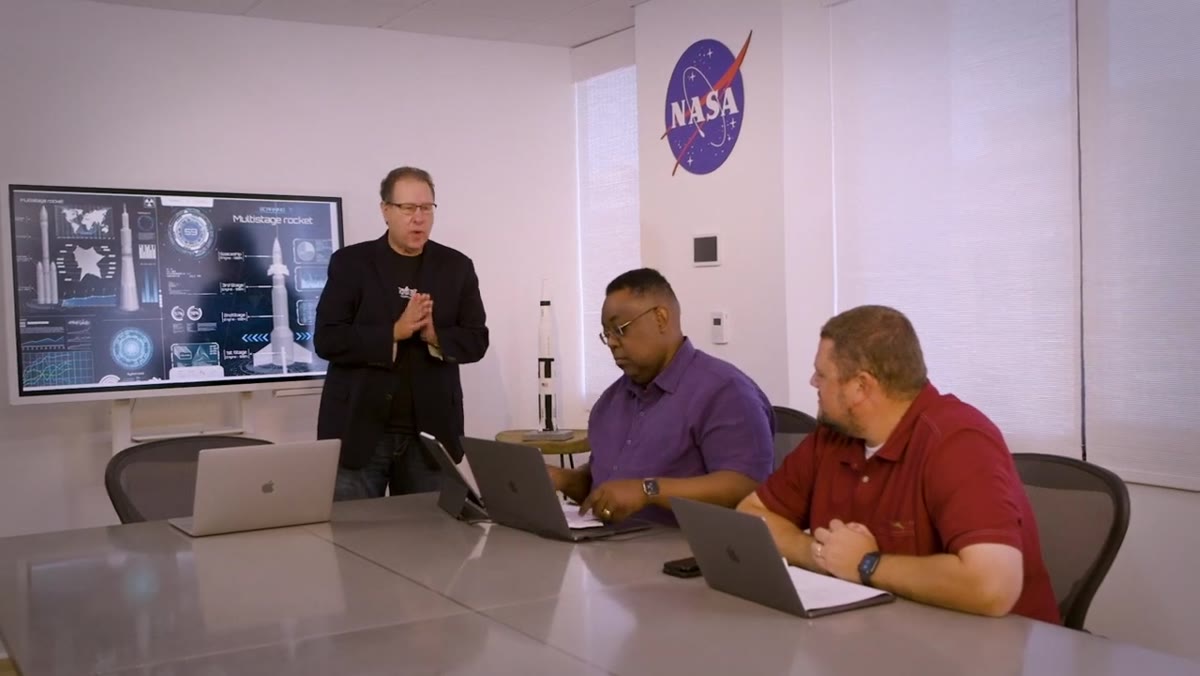 Scott pitching the space mission idea to his team