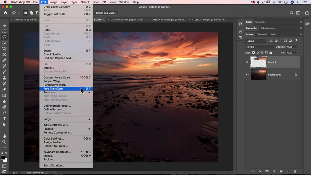 Free Transform handles visible around cloud layer being stretched