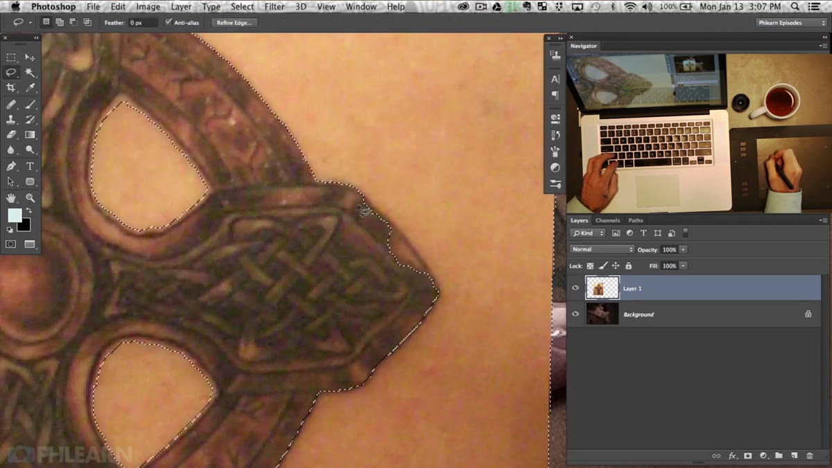 Lasso tool refining selection edges around tattoo border