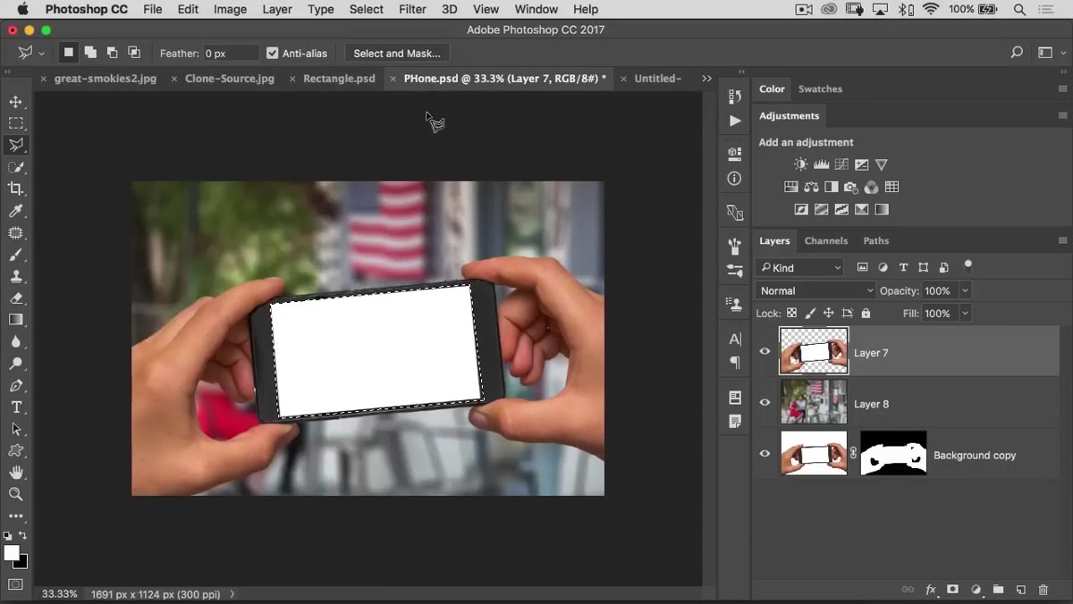 Quick Selection tool painting over a subject with a visible marching ants selection forming
