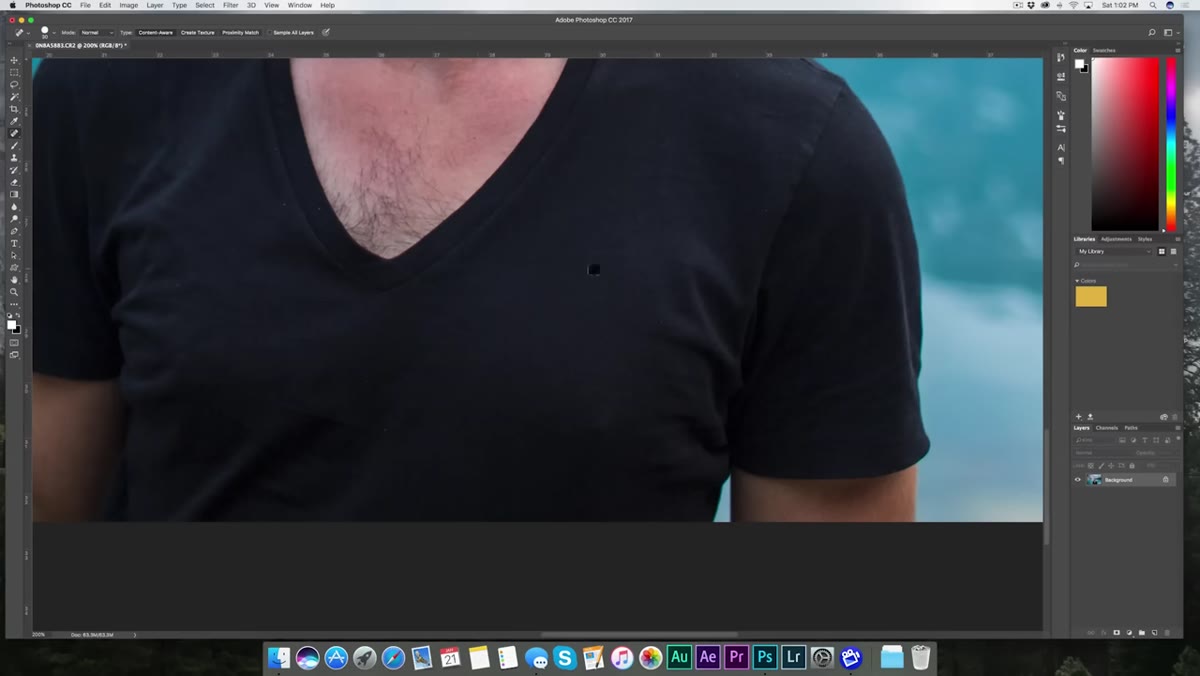 Spot Healing Brush removing dust speck from subject&rsquo;s shirt