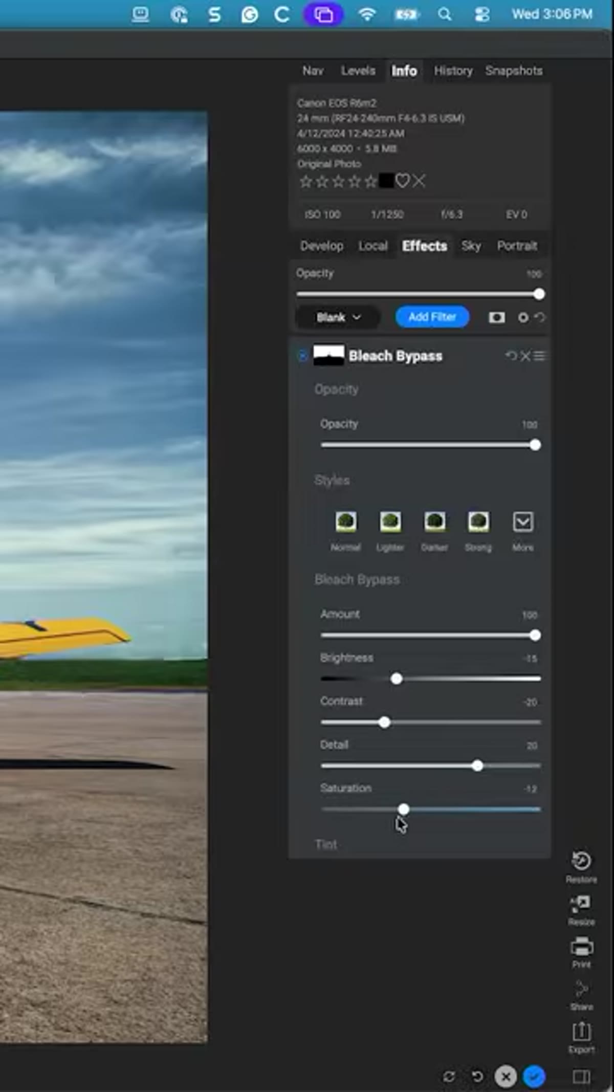 Saturation slider being adjusted to restore blue tones in sky