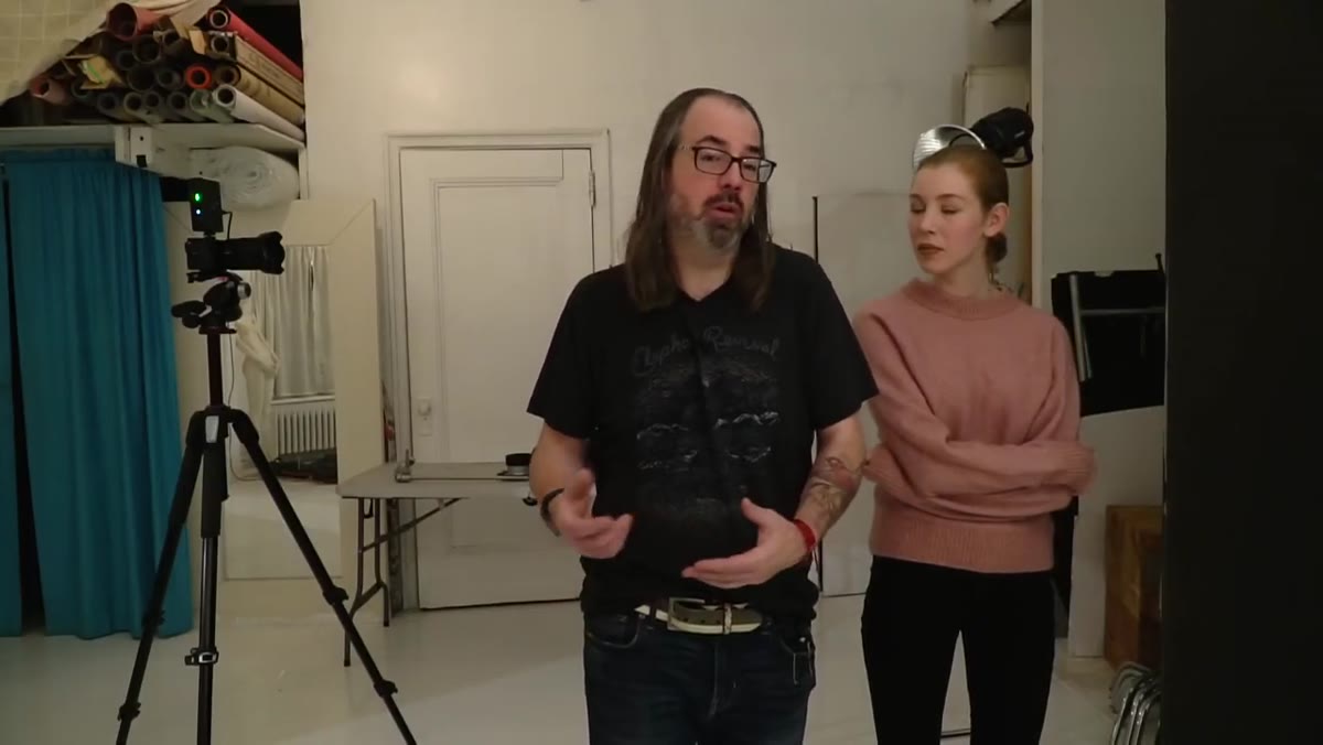 Studio strobe with no modifier pointing toward subject&rsquo;s face