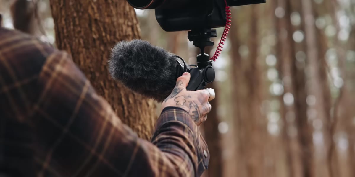 Arm extended outward showing longer vlogging reach