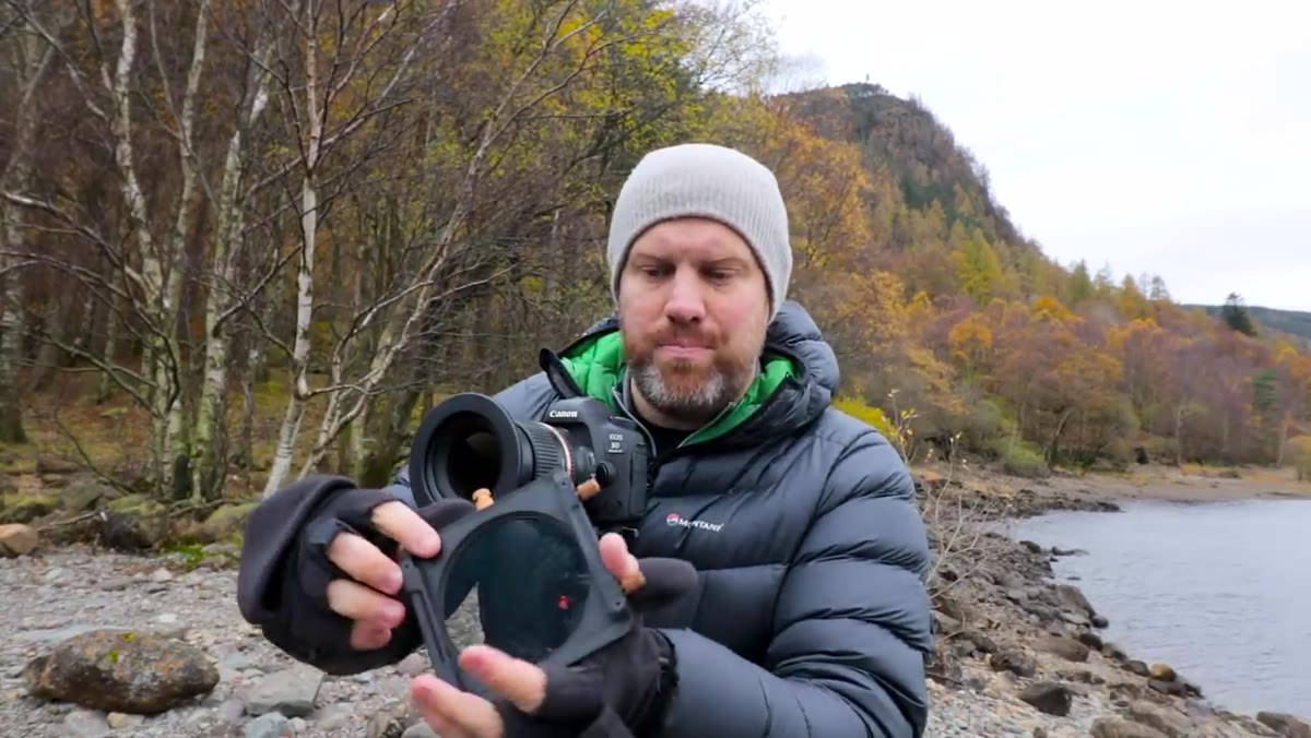 The metal PolarPro Summit bracket being attached to a lens adapter ring