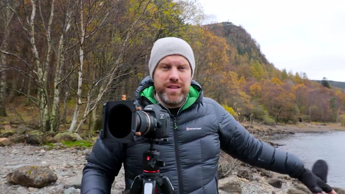 Ross holding up a graduated ND filter from the Summit system